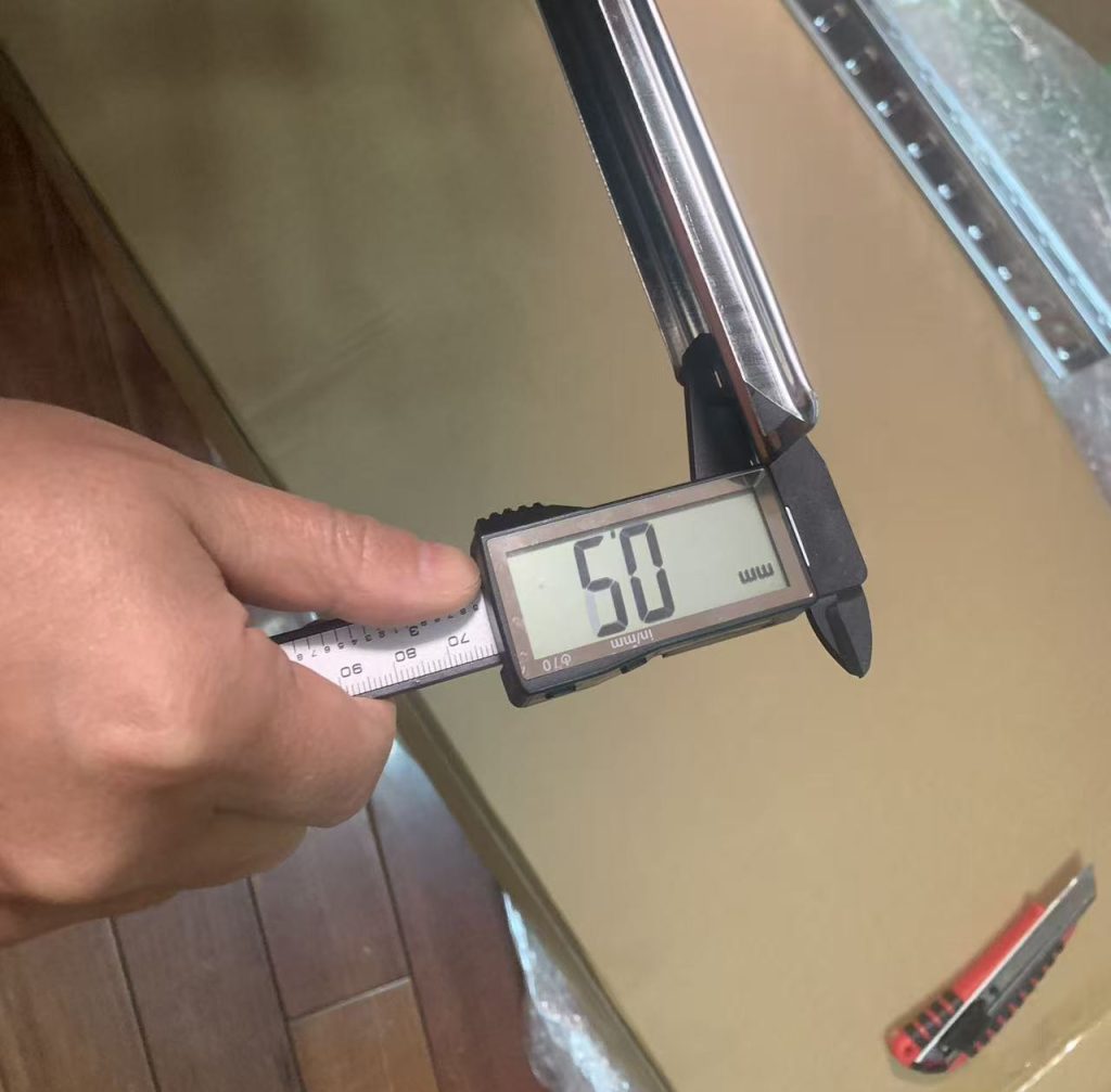 A professional China sourcing agent performing a meticulous quality control in China check on lighting products to ensure batch consistency.